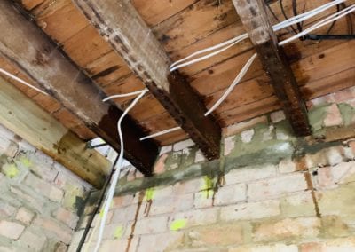 Photo of a wooden ceiling ready for insulation.