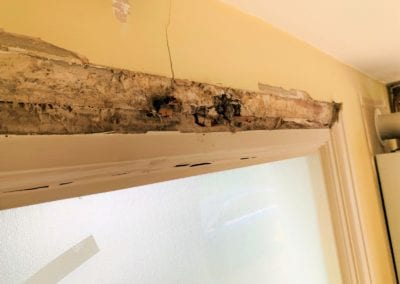 Photo of the top of a door frame.